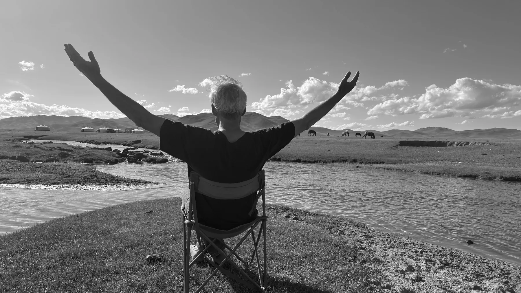 Guy Wathieu with open arms in the steppe.